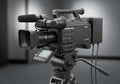 Professional ENG broadcast camera on tripod ready for capturing dynamic news footage Royalty Free Stock Photo