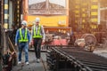 Professional engineer mechanic team working together in locomotive train deport work checking train spare parts in the locomotive Royalty Free Stock Photo