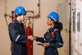 Professional engineer team man and women working at warehouse factory. Two Worker wearing safety uniform and Hard Hat checking at Royalty Free Stock Photo