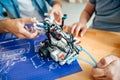 Professional engineers constructing the robot