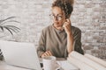 Professional entrepreneur work alone in home office workplace desk with laptop and paper documents. Business online job female Royalty Free Stock Photo