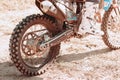 Close up motorcycle wheel on dust road, sand. Details. Motocross sport concept