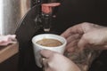 Professional espresso machine for brewing coffee. Coffee is poured into the Cup. The Concept Of Making Coffee In Cafe Royalty Free Stock Photo