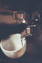 Professional espresso machine brewing a coffee. Coffee pouring i Royalty Free Stock Photo