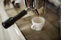 Professional espresso machine pouring strong looking fresh coffee Royalty Free Stock Photo