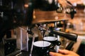 espresso machine preparing fresh espresso in two cups in bistro or restaurant