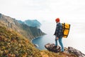 Professional expeditor standing on the edge cliff rock and looking forward away Royalty Free Stock Photo