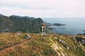 Professional expeditor standing on the edge cliff rock and looking forward away. Wanderlust Royalty Free Stock Photo