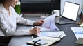 Professional female accountant checking reports at modern office Royalty Free Stock Photo