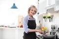 Professional female chef cooking vegetables Royalty Free Stock Photo