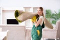 The professional female cleaner cleaning carpet Royalty Free Stock Photo