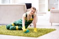 The professional female cleaner cleaning carpet Royalty Free Stock Photo