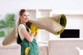 Professional female cleaner cleaning carpet Royalty Free Stock Photo