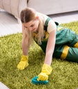 Professional female cleaner cleaning carpet Royalty Free Stock Photo