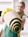 Professional female cleaner cleaning carpet Royalty Free Stock Photo