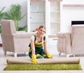 Professional female cleaner cleaning carpet Royalty Free Stock Photo