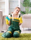 Professional female cleaner cleaning carpet Royalty Free Stock Photo