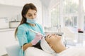 Professional female cosmetologist doing hydrafacial procedure in Cosmetology clinic. Doctor use hydra vacuum cleaner Royalty Free Stock Photo