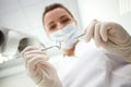 Professional female dentist is treating her Royalty Free Stock Photo