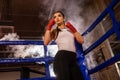 Professional female fighter in ring Royalty Free Stock Photo
