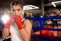Professional female fighter in ring Royalty Free Stock Photo