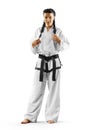 Professional female karate fighter isolated on the white background Royalty Free Stock Photo