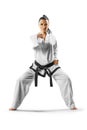 Professional female karate fighter isolated on the white background Royalty Free Stock Photo