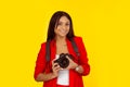 Professional female photographer holding digital camera Royalty Free Stock Photo