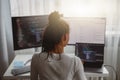 Professional female programmer working on new project on computer at home, back view Royalty Free Stock Photo