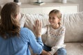 Professional female speech therapist praising little patient for success. Royalty Free Stock Photo