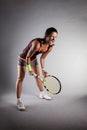 Professional female tennis player. Angry girl screaming with racket in hands Royalty Free Stock Photo