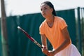 Professional female tennis player portrait on tennis court