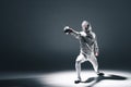 Professional fencer in fencing mask with rapier standing in position