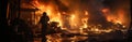 A professional firefighter puts out the flames. A burning house and a man in uniform, view from the back.