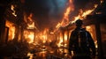 A professional firefighter puts out the flames. A burning house and a man in uniform, view from the back.