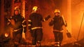 Professional Firefighters Crew Walking in a Smoke-Filled Forest, Controlling a Wildland Fire Before