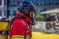 Professional fireman wearing a protective safety vest and a helmet