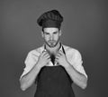 Professional food preparation concept. Man in cook hat and apron Royalty Free Stock Photo