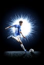 Professional football soccer player in action on black Royalty Free Stock Photo