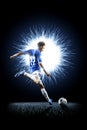 Professional football soccer player in action isolated on black Royalty Free Stock Photo