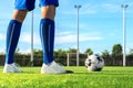 Professional football or soccer player kick and shoot ball at penalty or freekick to goalkeeper for winning champion goal in final Royalty Free Stock Photo