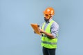 Professional foreman builder holds folder with project and checks development quality Royalty Free Stock Photo