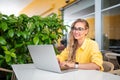 Professional freelancer working remotely on laptop at cafe