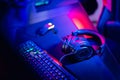 Professional gamers room with headphones microphone for cyber esports and video games on neon background of gaming Royalty Free Stock Photo