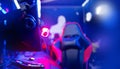 Professional gamers room with headphones microphone for cyber esports and video games on neon background of gaming Royalty Free Stock Photo