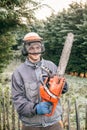 Professional gardener with chainsaw