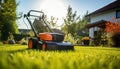 Professional gardener mowing the lush green lawn on a bright summer day view from the back