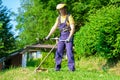 Professional gardener using an hedge trimmer in home garden Royalty Free Stock Photo