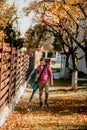 Professional gardener using leaf blower outdoor, in garden. Legs and device close up