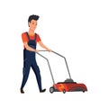 Professional gardener worker mowing lawn with electric push-mower in backyard. Male handyman cutting grass in garden